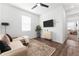 Cozy living room with a comfortable sofa, stylish rug, and modern decor, creating a welcoming space at 1639 Meadowlark Dr, Deltona, FL 32725