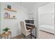 Functional home office with desk, dual monitors, and convenient shelf storage at 1639 Meadowlark Dr, Deltona, FL 32725