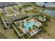 Aerial view of the community clubhouse, pool and amenity center, situated on a large lot near the water at 16781 Wingspread Loop, Winter Garden, FL 34787