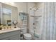 Cozy bathroom with modern fixtures and stylish shower curtain at 16781 Wingspread Loop, Winter Garden, FL 34787