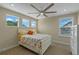 Comfortable bedroom featuring a full bed, natural light, and neutral wall color at 16781 Wingspread Loop, Winter Garden, FL 34787