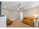 Comfortable bonus room featuring a ceiling fan and comfortable seating at 16781 Wingspread Loop, Winter Garden, FL 34787