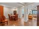Open concept dining area leading to kitchen and living room; showcasing hardwood floors at 16781 Wingspread Loop, Winter Garden, FL 34787