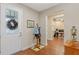 Inviting foyer with hardwood floors and coat rack at 16781 Wingspread Loop, Winter Garden, FL 34787