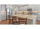 Stunning kitchen with stainless steel appliances, granite countertops, and a breakfast bar at 16781 Wingspread Loop, Winter Garden, FL 34787