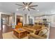 Open-concept living room showcasing hardwood floors, recessed lighting, and seamless flow into the kitchen at 16781 Wingspread Loop, Winter Garden, FL 34787
