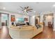 Spacious living room featuring hardwood floors, recessed lighting, and an open floor plan at 16781 Wingspread Loop, Winter Garden, FL 34787