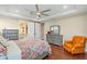 Main bedroom featuring a ceiling fan and access to the en suite bathroom at 16781 Wingspread Loop, Winter Garden, FL 34787