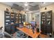 Spacious office area featuring dark wood cabinets and ample lighting at 16781 Wingspread Loop, Winter Garden, FL 34787