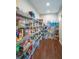 Spacious walk-in pantry with wood floors and ample shelving for organized storage at 16781 Wingspread Loop, Winter Garden, FL 34787