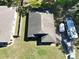Aerial view of a property, featuring a well-maintained roof and surrounding landscape at 1931 Clarcona Rd, Apopka, FL 32703