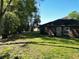Expansive backyard featuring lush green grass, providing ample space for outdoor activities and relaxation at 1931 Clarcona Rd, Apopka, FL 32703