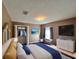 Contemporary bedroom with a blue and white color scheme and a closet at 1931 Clarcona Rd, Apopka, FL 32703
