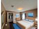 Comfortable bedroom with a wooden bed frame, closet and a calming atmosphere at 1931 Clarcona Rd, Apopka, FL 32703