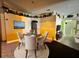Cozy dining area with a round table, four chairs, and decorative wall accents at 1931 Clarcona Rd, Apopka, FL 32703