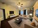 Bright living room with contemporary furnishings, ceiling fan, and modern decor at 1931 Clarcona Rd, Apopka, FL 32703
