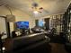 Comfortable living room featuring leather seating, ceiling fan, and a TV at 1931 Clarcona Rd, Apopka, FL 32703