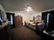 Spacious bedroom featuring a detailed iron bed frame, a dresser and natural light at 1931 Clarcona Rd, Apopka, FL 32703