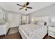 Bright bedroom with a ceiling fan, vinyl floors, and light-colored furniture, creating a serene and inviting atmosphere at 2136 Topping Pl, Eustis, FL 32726