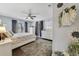 Spacious bedroom with light paint, vinyl floors, and a ceiling fan, complete with bright and comfortable decor at 2136 Topping Pl, Eustis, FL 32726