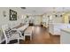 Open-concept kitchen and dining area perfect for entertaining, with an island and modern décor at 2136 Topping Pl, Eustis, FL 32726