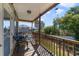 Relaxing front porch with wooden railings, seating, and neighborhood views at 2136 Topping Pl, Eustis, FL 32726
