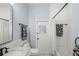 Bathroom showcases a white shower curtain, subway tiles, black hardware and door to the backyard at 2140 Lilypad Ln, Windermere, FL 34786