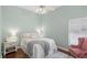 Airy bedroom featuring hardwood floors, a window, and a comfortable bed at 2140 Lilypad Ln, Windermere, FL 34786
