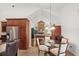 Charming breakfast nook with vaulted ceilings and views to the fireplace and living area at 2140 Lilypad Ln, Windermere, FL 34786