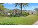 Charming single-story home with well-manicured lawn and mature landscaping, creating inviting curb appeal at 2140 Lilypad Ln, Windermere, FL 34786
