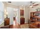 Comfortable home office featuring a wood desk, chair, and hardwood flooring at 2140 Lilypad Ln, Windermere, FL 34786