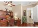 Comfortable home office featuring a wood desk, chair, and hardwood flooring at 2140 Lilypad Ln, Windermere, FL 34786