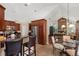 Open kitchen featuring granite countertops, stainless appliances, and adjacent breakfast nook at 2140 Lilypad Ln, Windermere, FL 34786