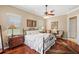 Serene main bedroom with hardwood floors, a ceiling fan, and ample natural light at 2140 Lilypad Ln, Windermere, FL 34786