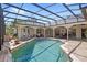 A luxurious screened-in pool and spa, offering a perfect spot for relaxation and enjoying outdoor leisure at 2140 Lilypad Ln, Windermere, FL 34786