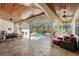 Expansive screened-in pool area with outdoor seating, dining, and summer kitchen, perfect for entertaining at 2140 Lilypad Ln, Windermere, FL 34786