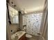 Bathroom featuring a unique shower curtain and ample storage at 227 Strawberry Ln, Daytona Beach, FL 32117