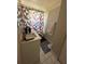 Modest bathroom featuring a sink vanity and shower with a geometric curtain at 227 Strawberry Ln, Daytona Beach, FL 32117