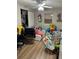 This bedroom is currently in use as a playroom with many toys and activities at 227 Strawberry Ln, Daytona Beach, FL 32117
