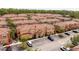 Aerial view of the townhomes featuring red tile roofs and manicured landscaping at 2653 Roadster Ln, Kissimmee, FL 34746