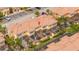 Aerial view of the townhomes featuring screened patios and red tile roofs at 2653 Roadster Ln, Kissimmee, FL 34746