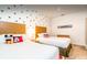 Themed bedroom featuring two twin beds adorned with colorful Mickey Mouse decor at 2653 Roadster Ln, Kissimmee, FL 34746