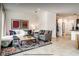 Cozy living room with tile floors, stylish decor, and lots of natural light at 2653 Roadster Ln, Kissimmee, FL 34746