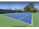 Well-maintained tennis court featuring a green and blue playing surface and professional net at 2653 Roadster Ln, Kissimmee, FL 34746