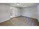 Comfortable bedroom with soft carpet and natural light streaming through the open doorway at 2936 Woodcrest Ln, Lakeland, FL 33805