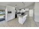 Modern kitchen with white cabinets, stainless steel appliances, and an island with countertop seating at 2936 Woodcrest Ln, Lakeland, FL 33805