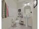 Powder room with toilet and pedestal sink at 3624 Belle Rose Dr, Leesburg, FL 34748