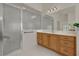 Bathroom featuring a glass enclosed shower, vanity and tile floor at 3624 Belle Rose Dr, Leesburg, FL 34748