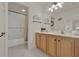 Bathroom with shower/tub combo, double vanity, and tile floors at 3624 Belle Rose Dr, Leesburg, FL 34748