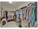 Walk-in closet with plenty of shelving and hanging space for storage at 3624 Belle Rose Dr, Leesburg, FL 34748